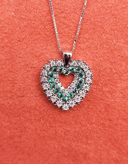 Collana DonnaOro Mistero con Cuore in Oro bianco 18kt con Smeraldi e Diamanti