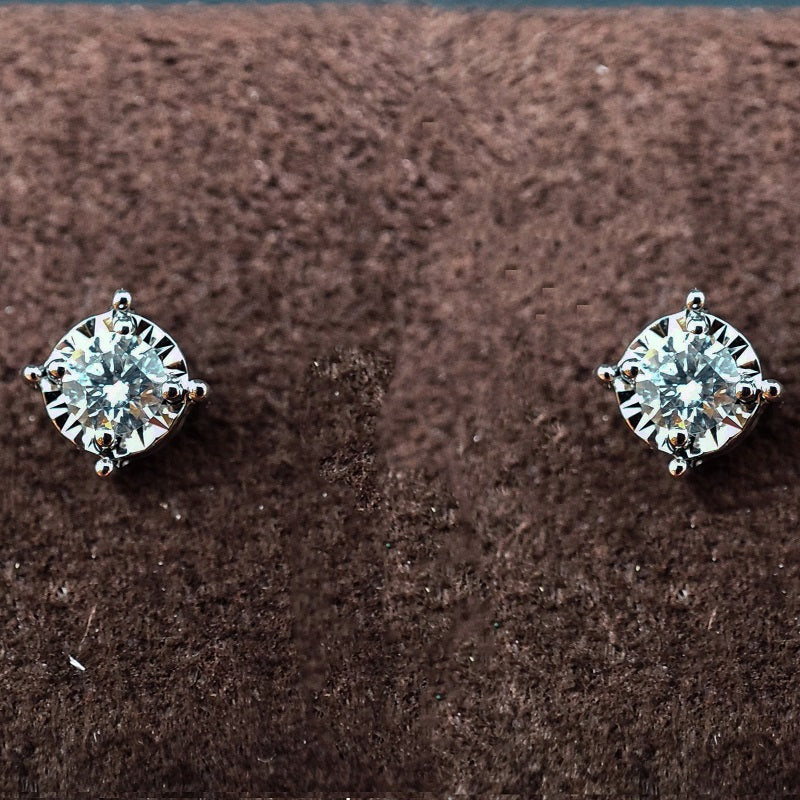 Orecchini DonnaOro ETERNA Punti luce in Oro Bianco 18kt e Diamanti 0.20ct